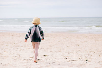 Rear view of woman on beach