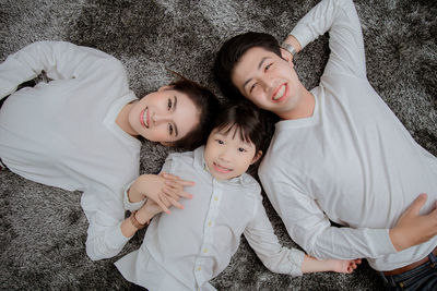Portrait of a smiling girl lying down