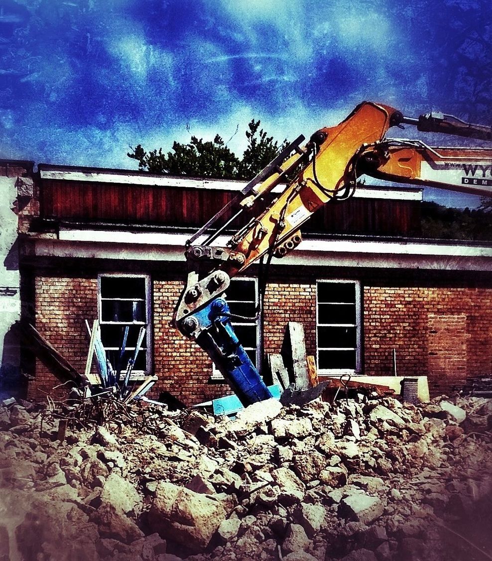 building exterior, architecture, built structure, house, sky, residential structure, window, residential building, low angle view, cloud - sky, abandoned, old, cloud, building, damaged, blue, deterioration, weathered, run-down, outdoors