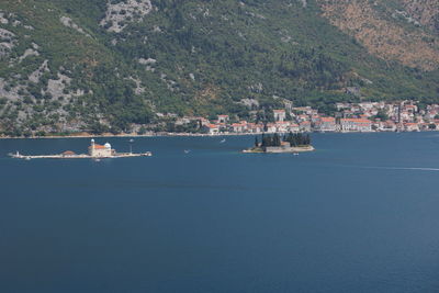 Scenic view of sea against buildings