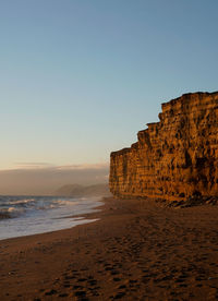 Sunset on the beach, hive beach in dorset