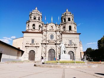 Facade of historic building against blue sky