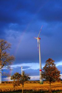 Low angle view of windmill against sky