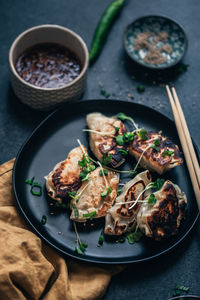 High angle view of dumplings in plate on table