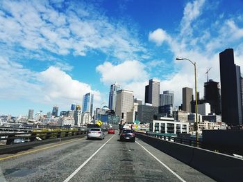 View of city against cloudy sky