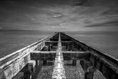 Pier over sea against sky