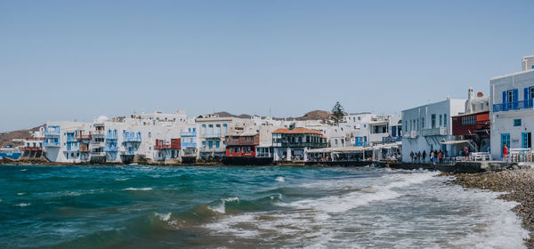 Panoramic view of restaurants in little venice, mykonos town, greece.