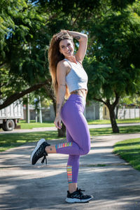 Side view of young woman exercising at park