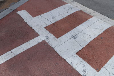 High angle view of arrow sign on road