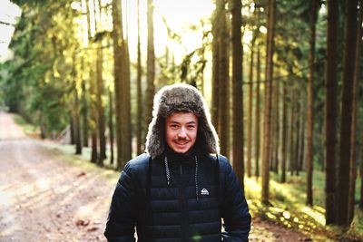 Portrait of young woman in forest