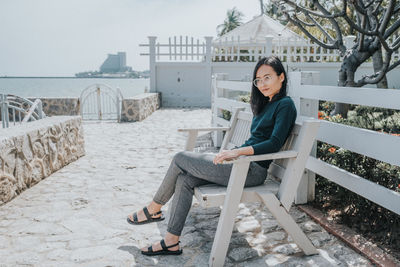 Portrait of woman sitting on seat