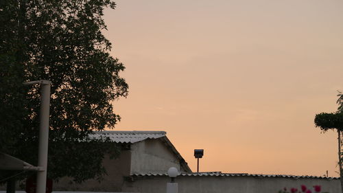 House against sky during sunset