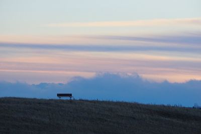Scenic view of landscape against sky at sunset