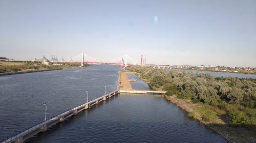 Bridge over river against sky