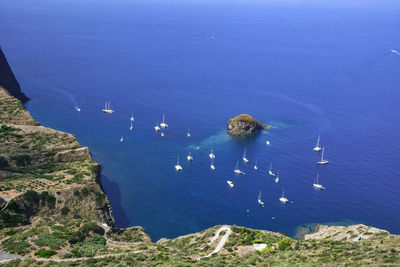 High angle view of sailboats in sea