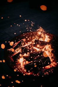 High angle view of lit candles on table