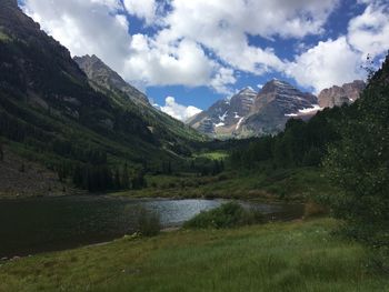 Scenic view of lake and mountains against sky