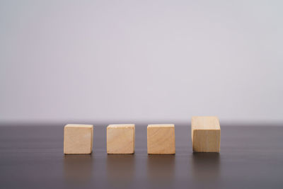 Close-up of wooden table against white background