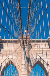 Low angle view of bridge and us flag