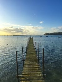 Pier over sea against sky