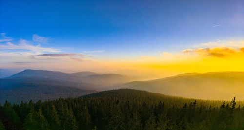 Scenic view of mountains against sky during sunset