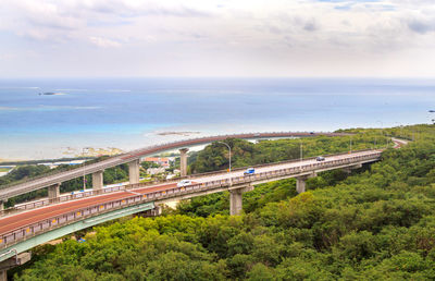 High angle view of okinawa nirai kanai bridge against sky
