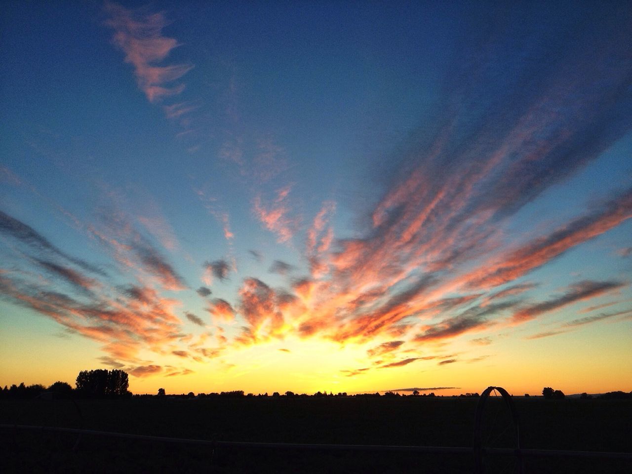 sunset, sky, silhouette, orange color, scenics, tranquility, beauty in nature, tranquil scene, cloud - sky, dramatic sky, nature, idyllic, cloud, moody sky, dusk, outdoors, cloudy, low angle view, no people, sun