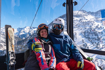 Panoramic view of people on snowcapped mountain