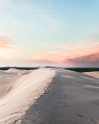 Scenic view of beach against sky during sunset