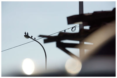 Low angle view of street light against sky