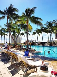 View of swimming pool by sea against clear sky