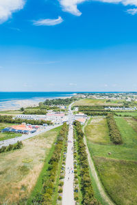 Scenic view of land and sea against sky