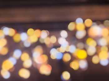 Defocused image of illuminated lights at night