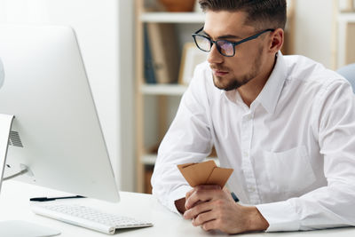 Young man using laptop at home