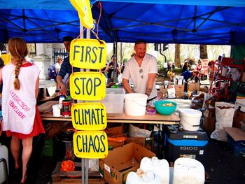 Group of people for sale at market stall