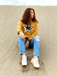 Young woman sitting outdoors