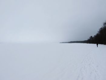 Scenic view of landscape against sky during winter