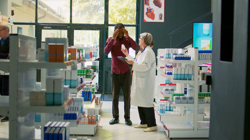 Rear view of woman standing in laboratory