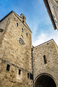 Low angle view of old building against sky