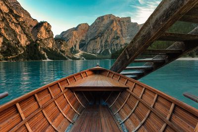 Boat in lake against mountains