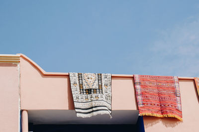 Low angle view of building against clear blue sky