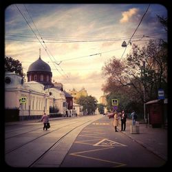 City street against cloudy sky