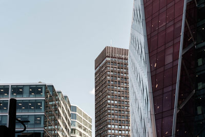 Low angle view of modern buildings against clear sky