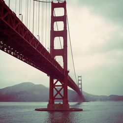 Low angle view of golden gate bridge against sky