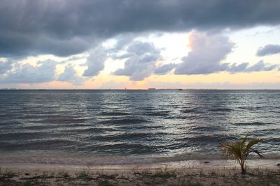 Scenic view of sea against sky at sunset