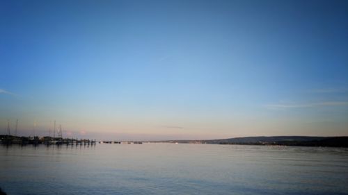 Scenic view of sea against sky at sunset