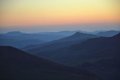 Scenic view of mountains at sunset