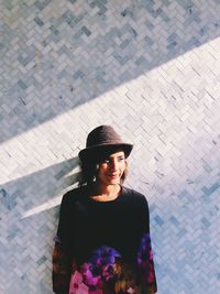 Woman standing on wall
