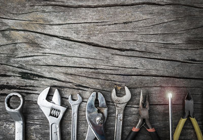 Close-up of work tools on wooden table