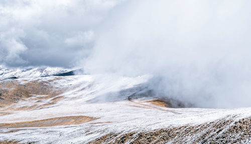 Severe cold landscape of foggy snowy pyrenees mountains with envalira pass in winter day